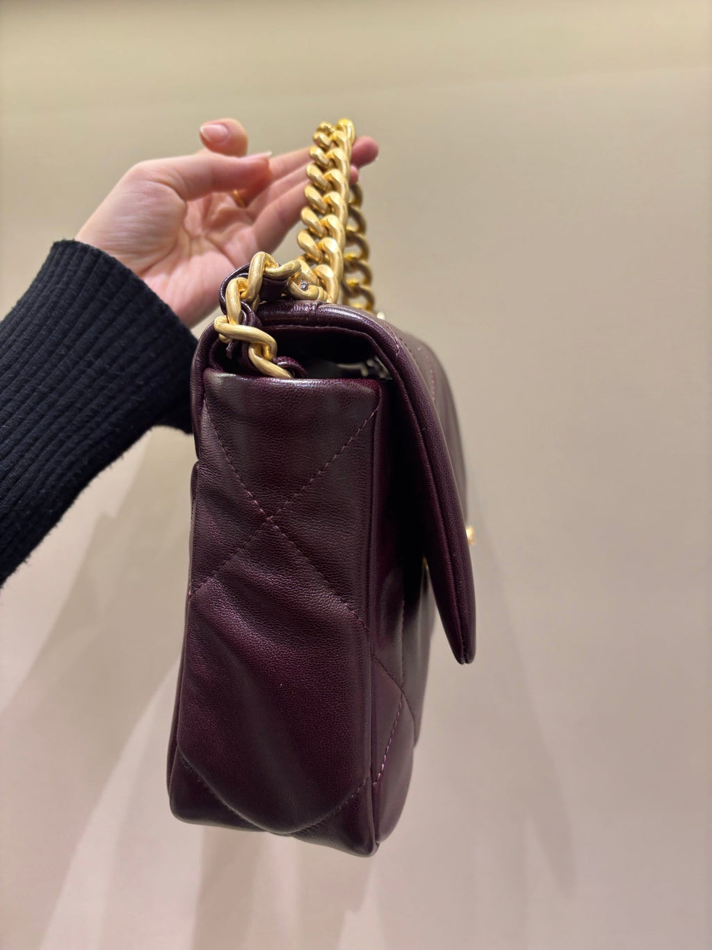 Chanel 19 burgundy flap bag side view