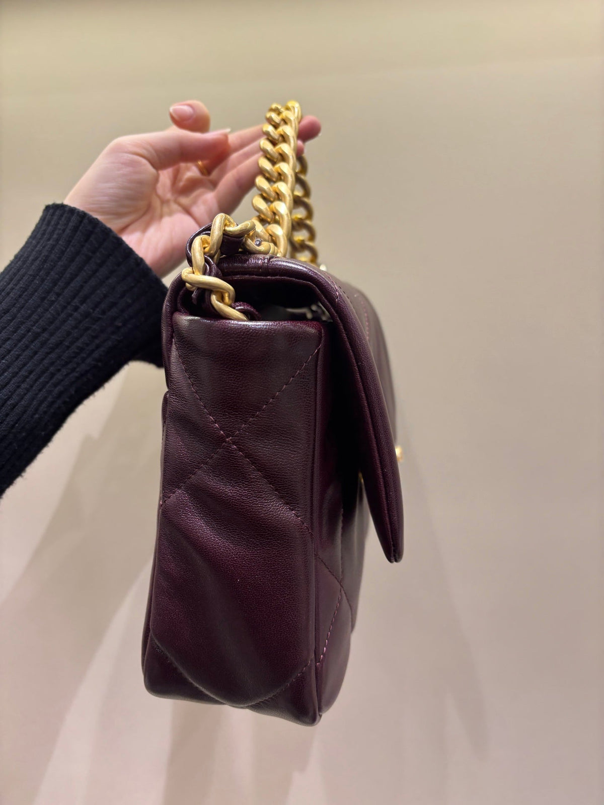 Chanel 19 burgundy flap bag side view