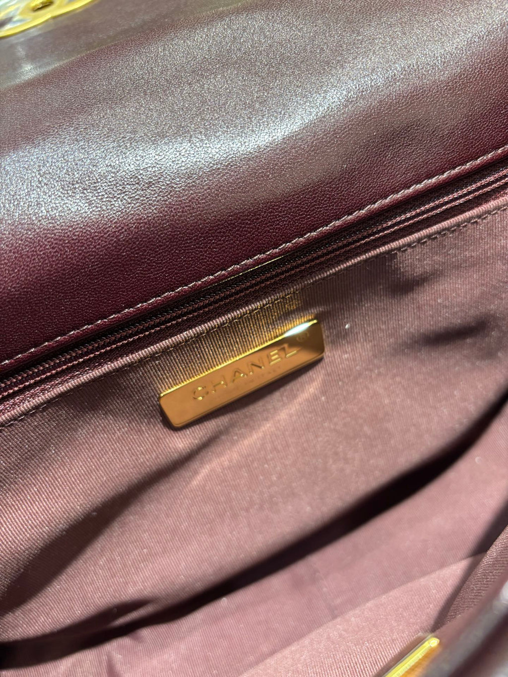 Chanel 19 burgundy flap bag interior label detail