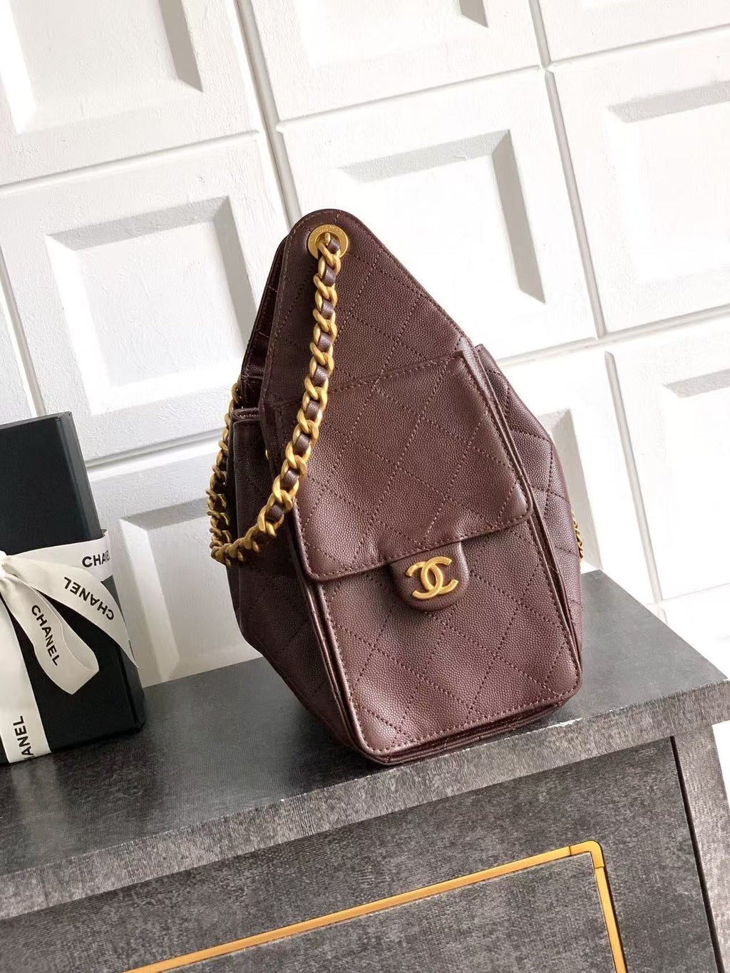 Chanel 25 burgundy handbag front and side view