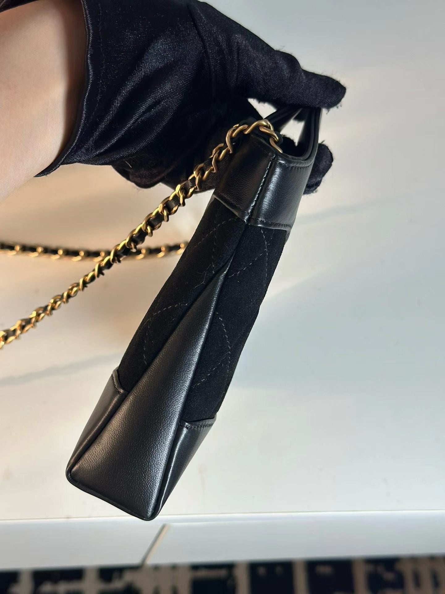 31 Bag Nano Black front view with gold chain