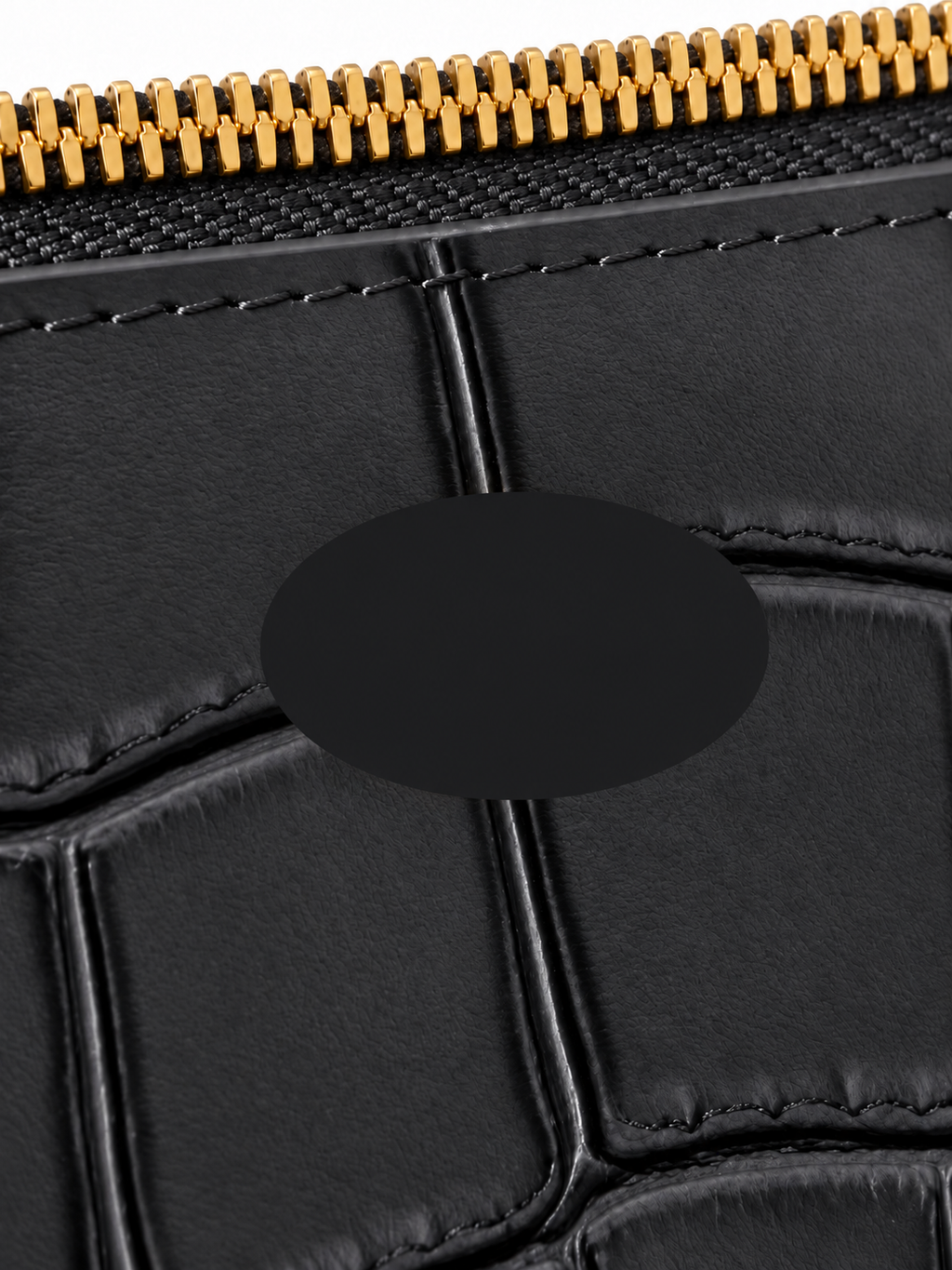 Dark gray vanity bag detail with logo covered