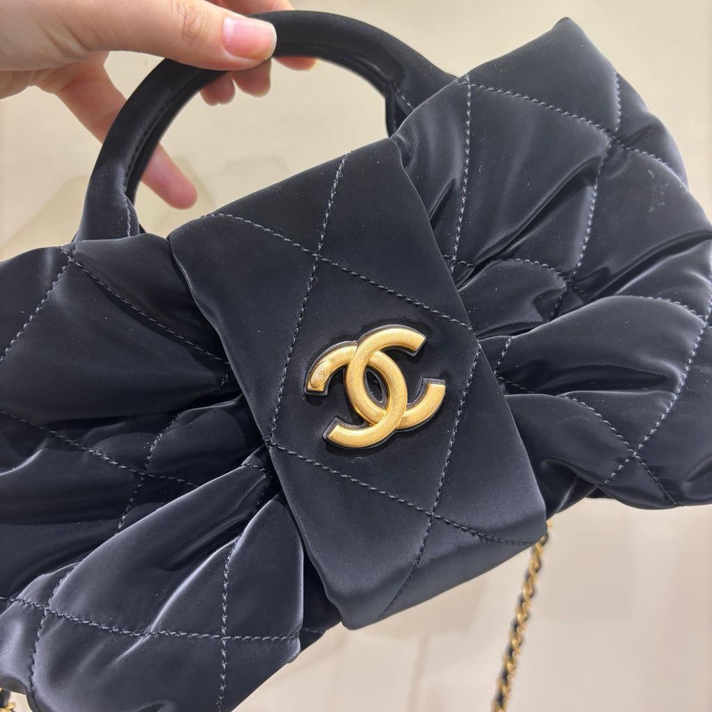 Chanel black quilted bow bag CC logo detail