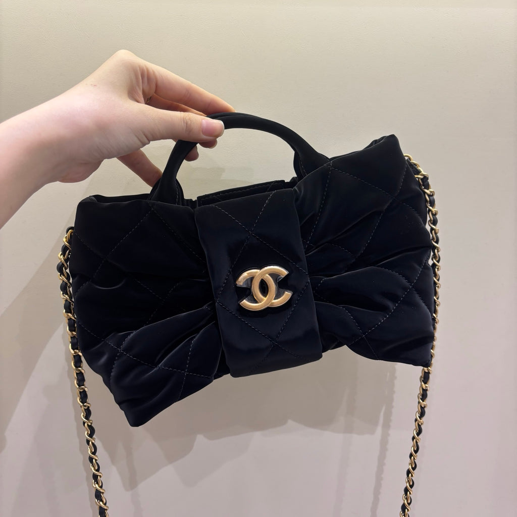 Chanel black quilted bow bag, front view