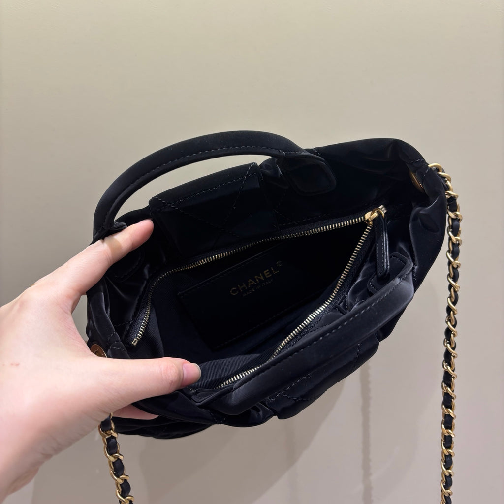 Chanel black quilted bow bag open interior