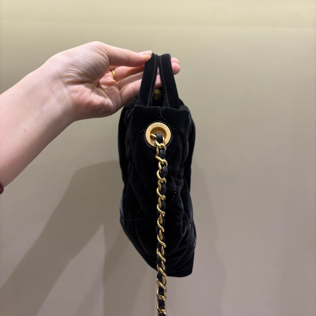 Chanel black quilted bow bag, side view