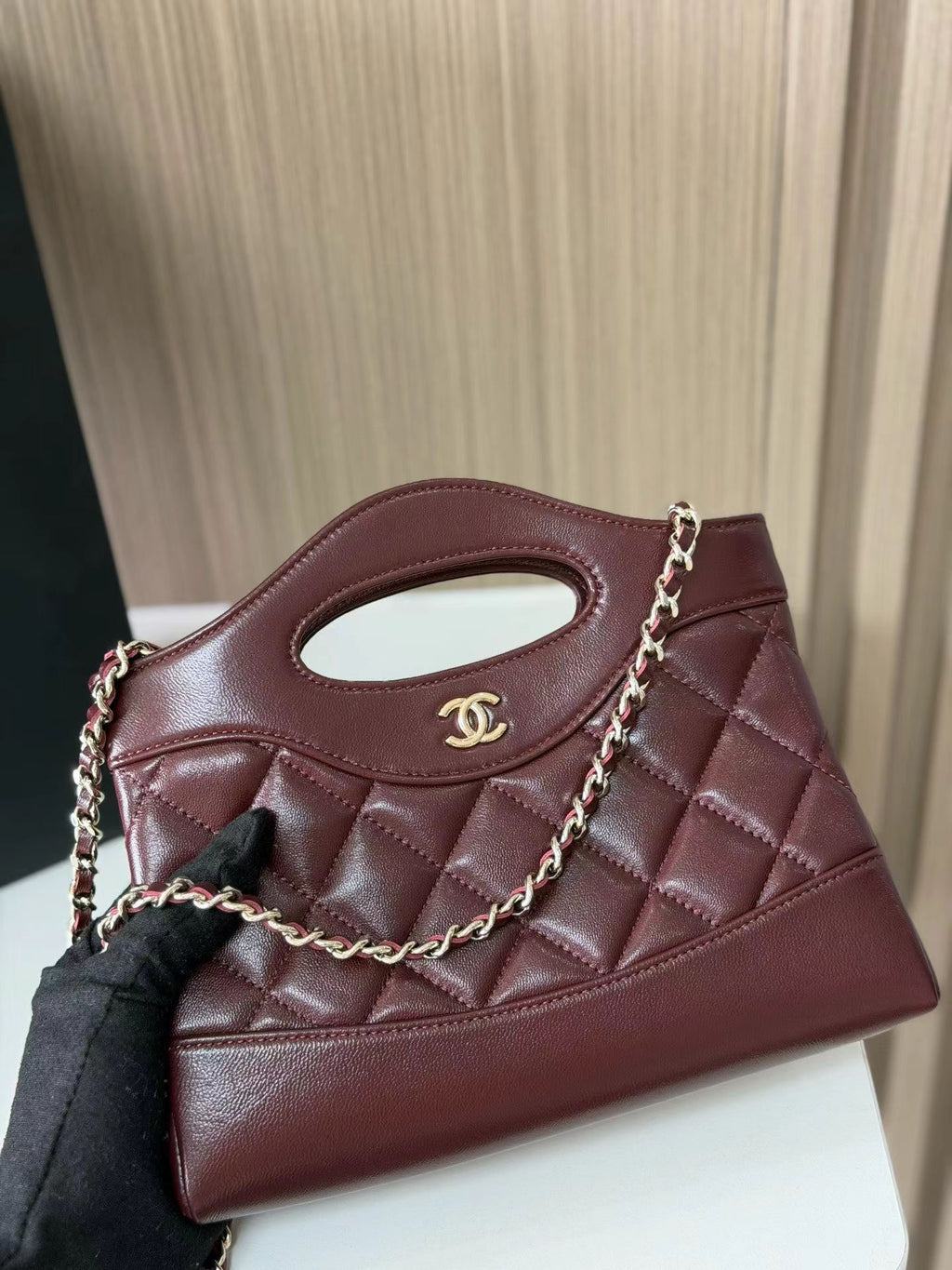 Burgundy quilted mini handbag front view