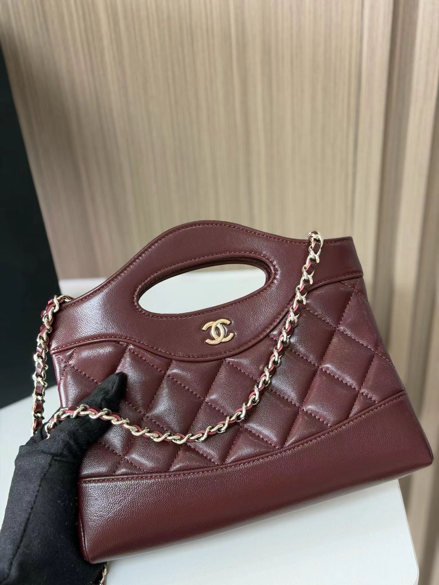 Burgundy quilted mini handbag front view