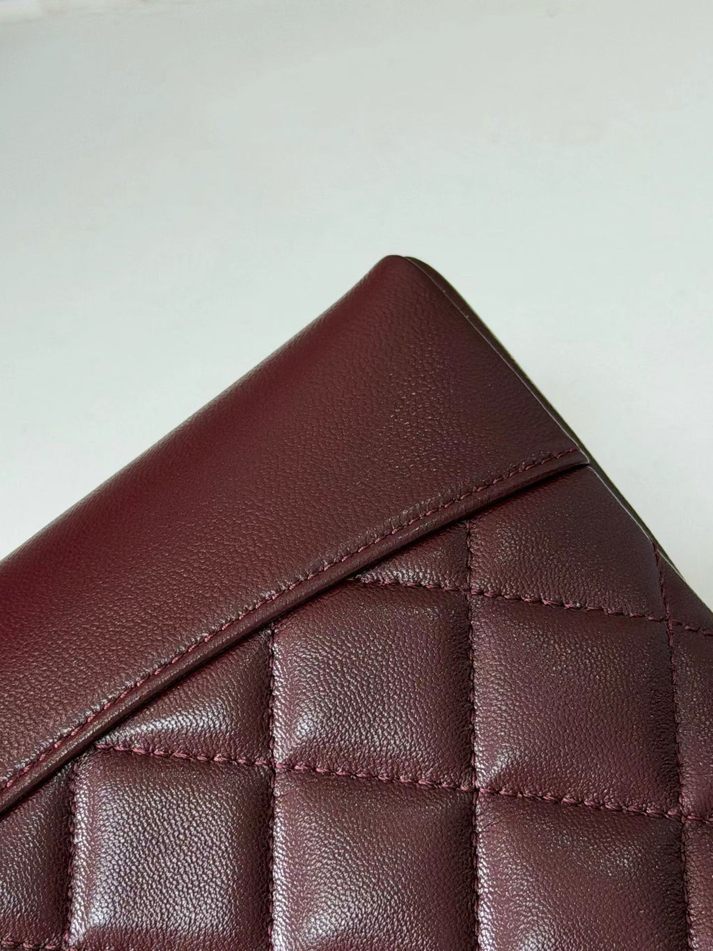 Burgundy quilted mini handbag leather detail