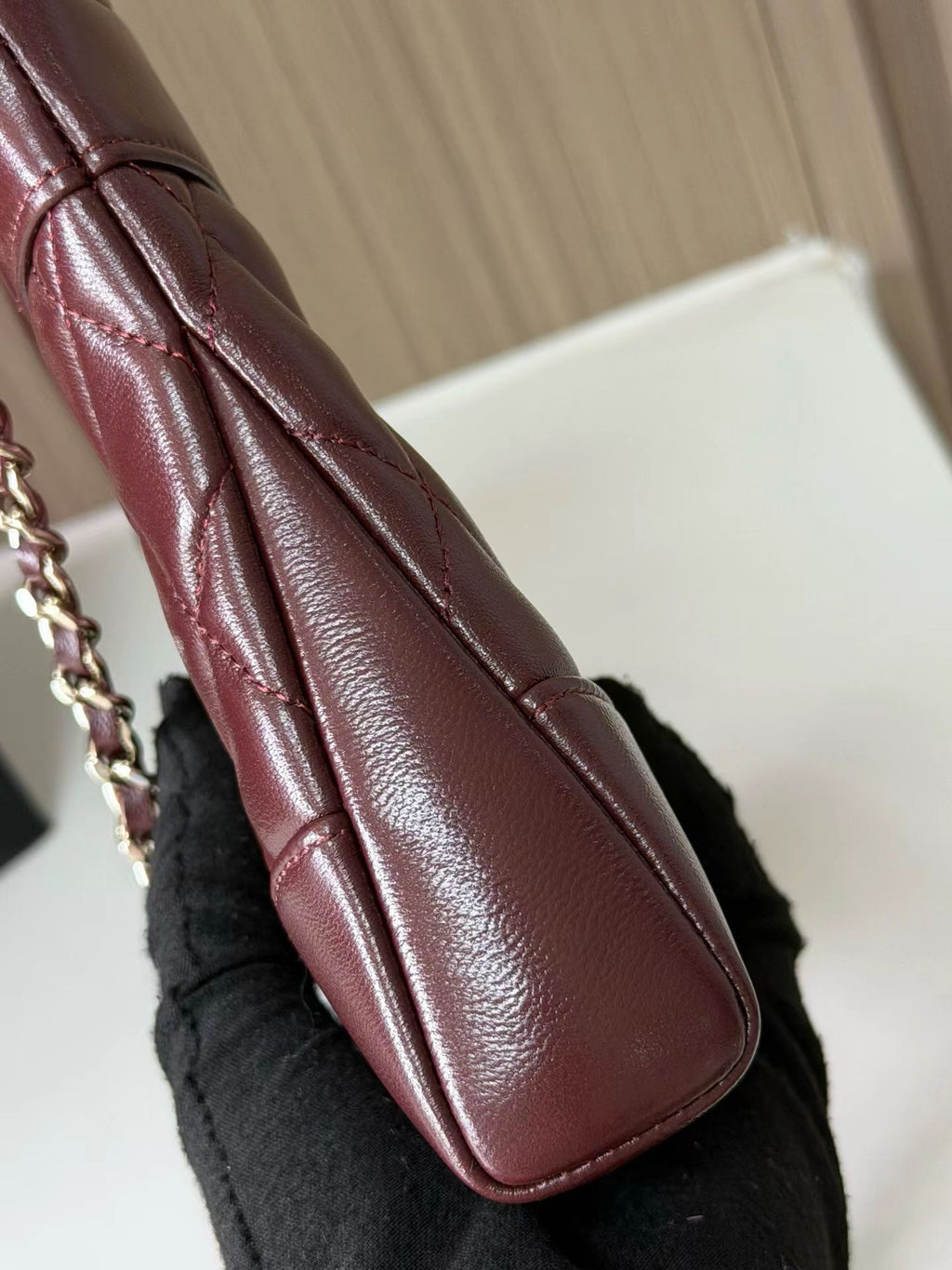 Burgundy quilted mini handbag side detail