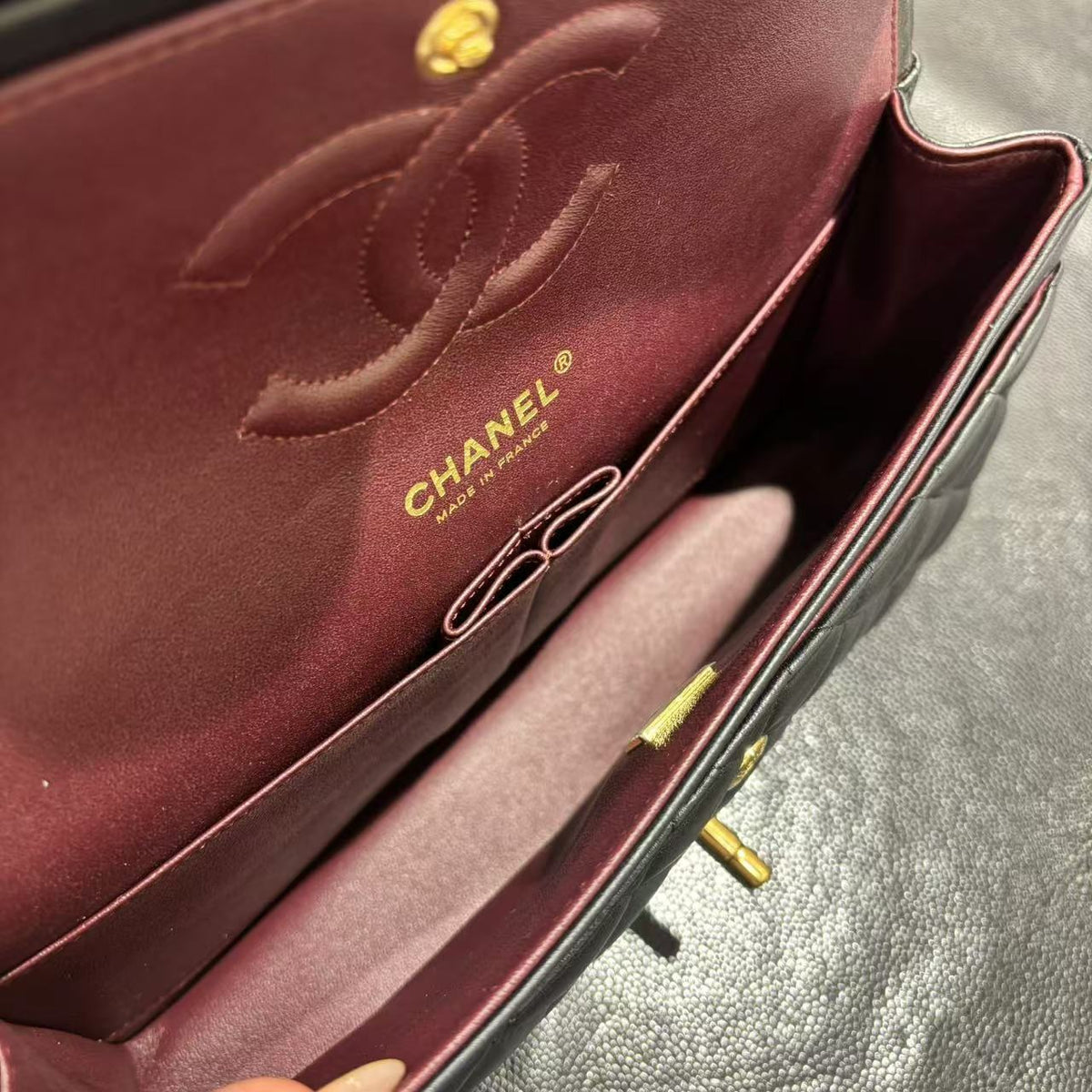 Chanel Classic Flap bag black and burgundy interior detail