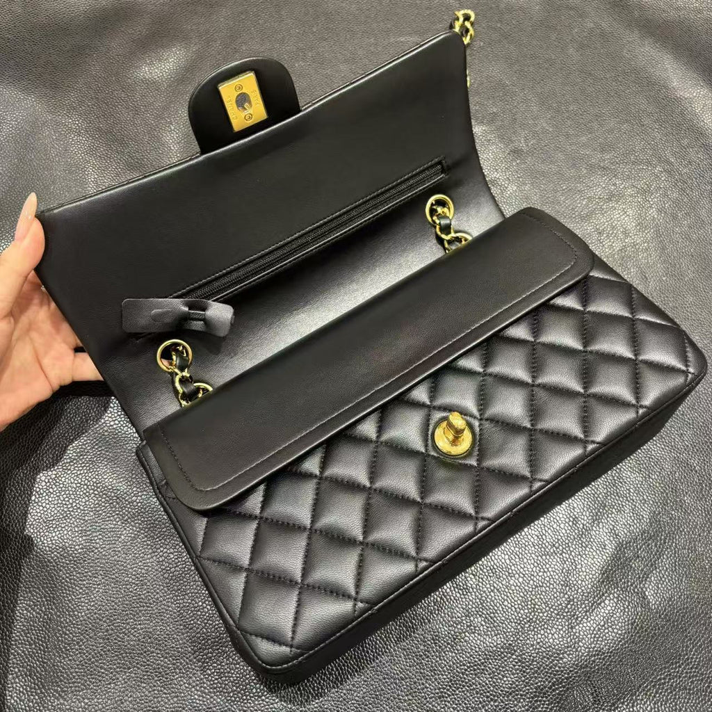 Chanel Classic Flap bag in black, open double flap