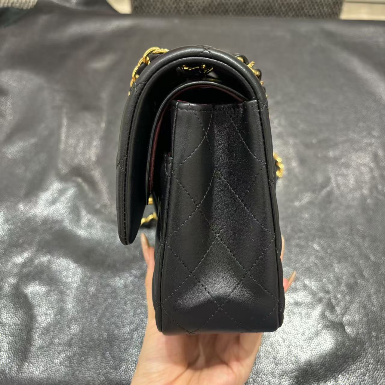 Chanel Classic Flap bag in black, side view