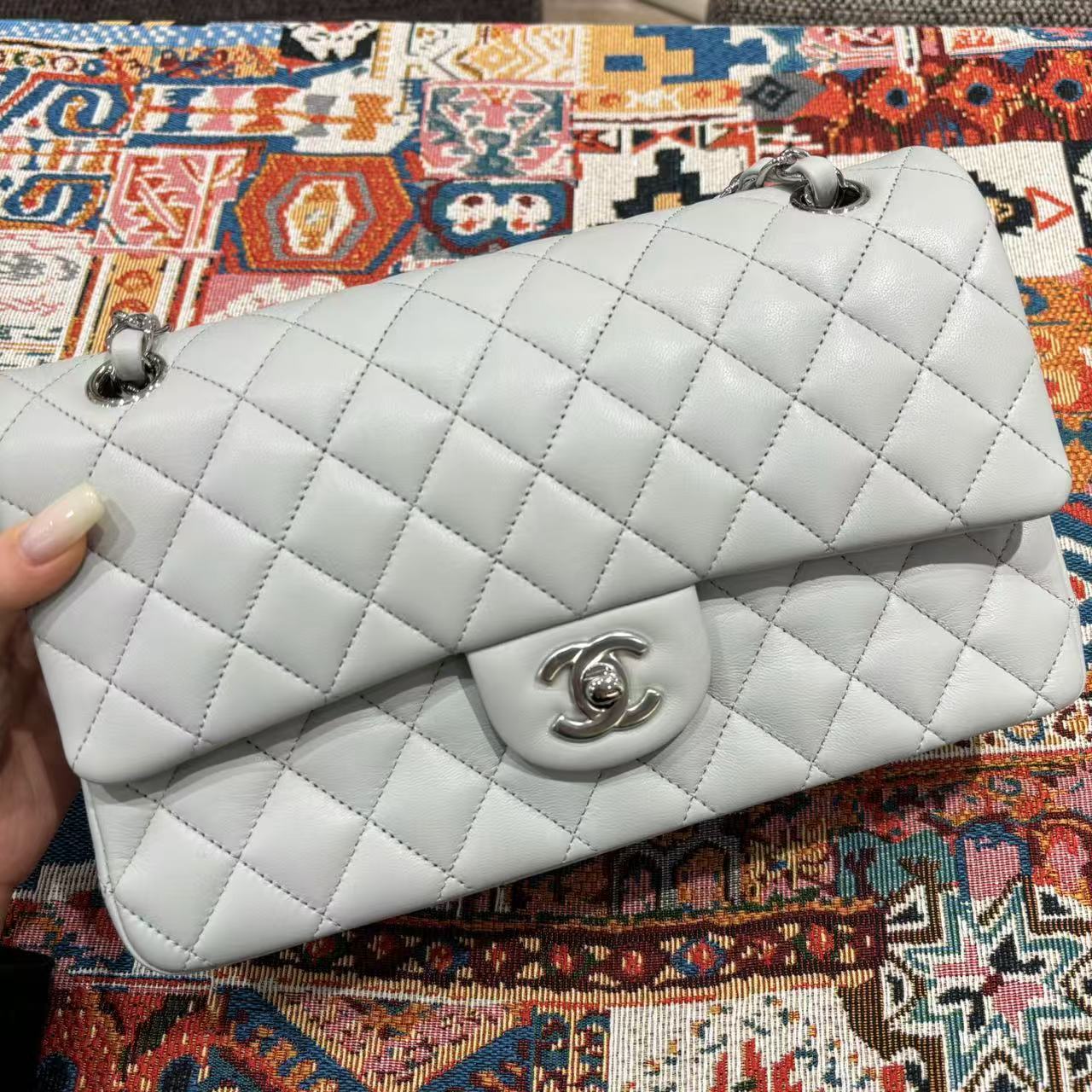 Chanel Classic Flap bag in light gray, front view