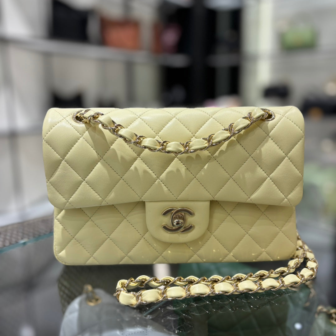 Chanel Classic Flap bag in pale yellow, angled front view