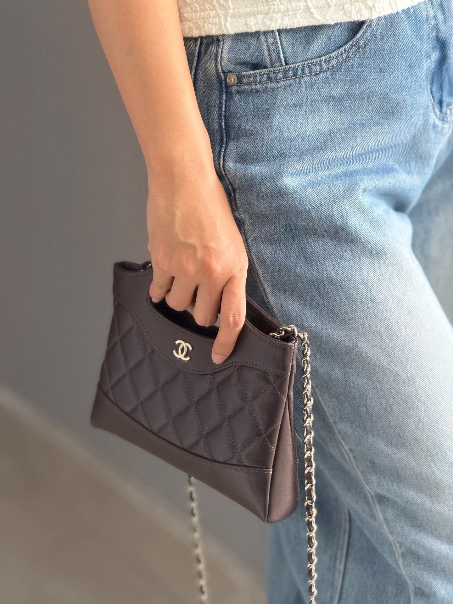 Dark brown quilted mini handbag hand carry