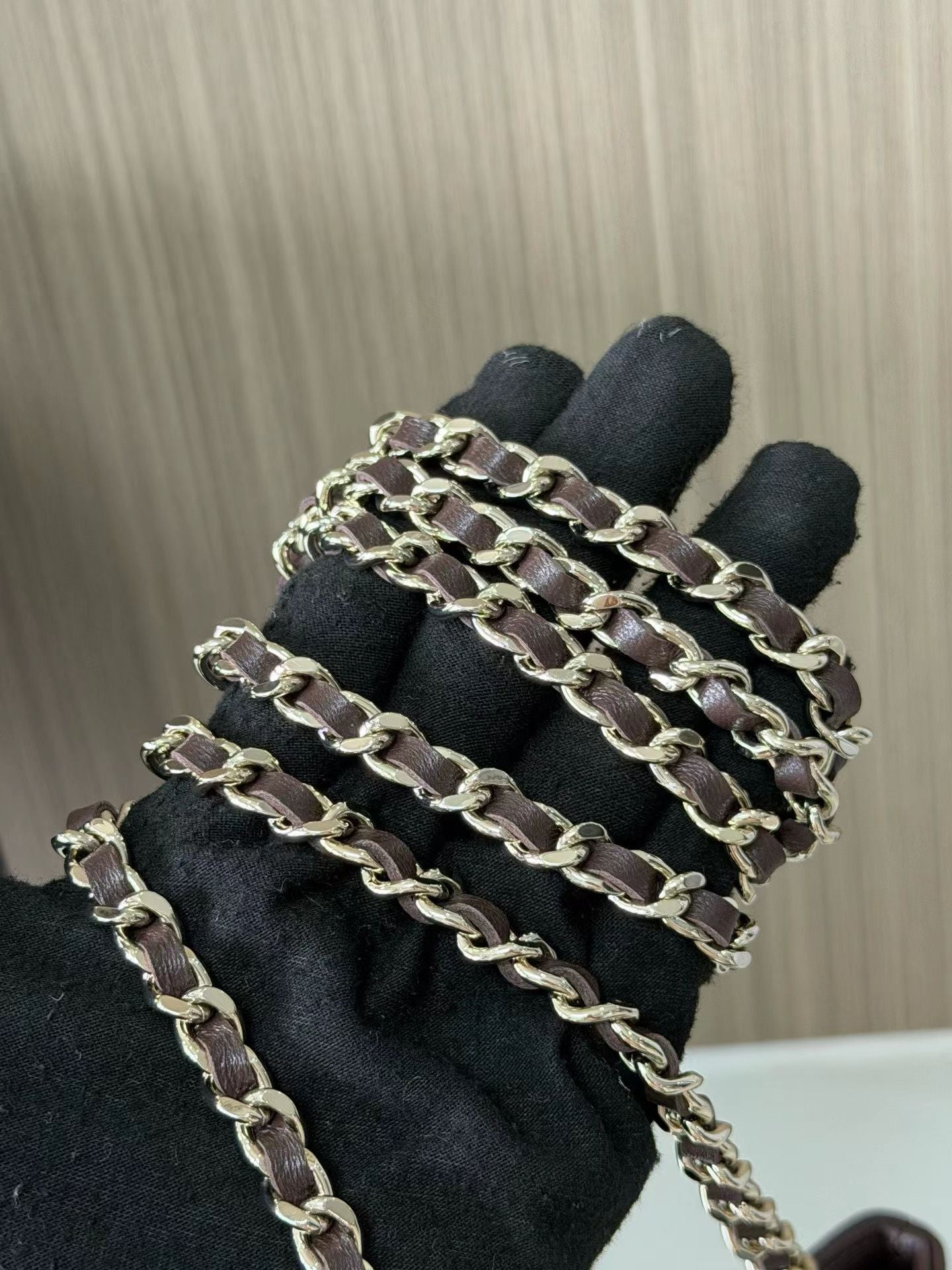 Dark brown mini handbag chain detail