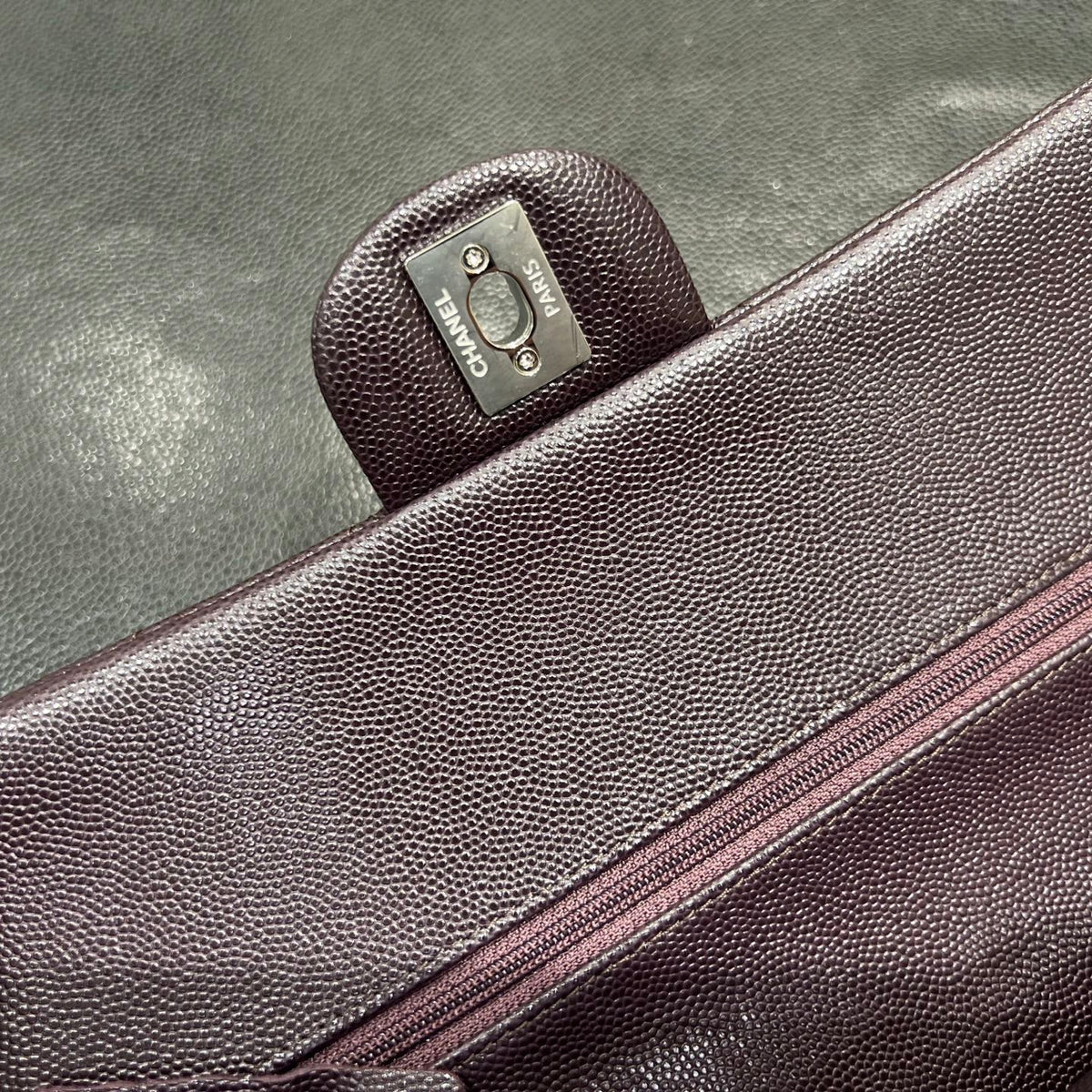 Chanel dark burgundy classic flap bag closure detail