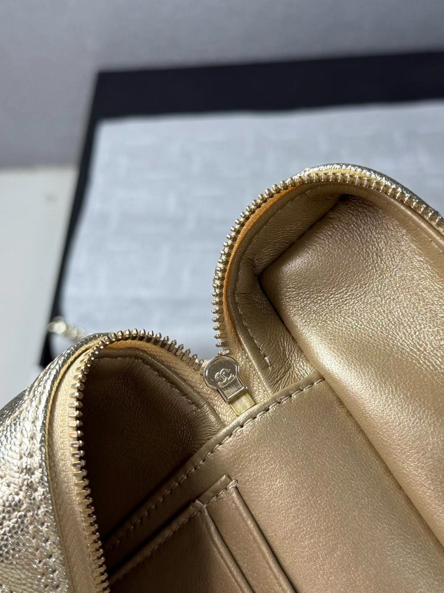 Gold handbag zipper and interior detail