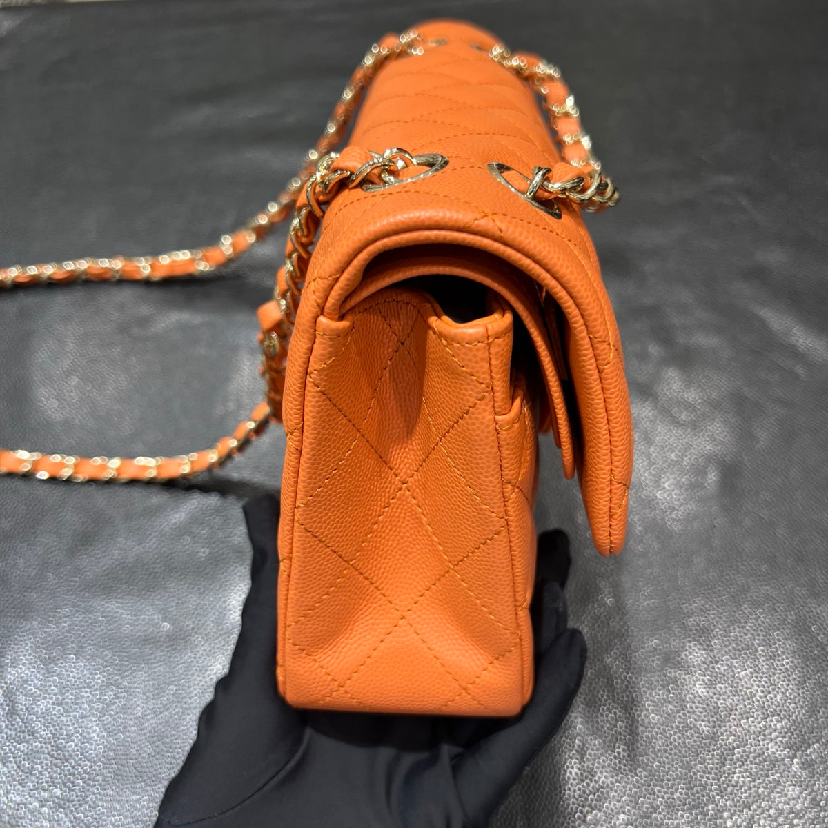 Chanel orange classic flap bag side view