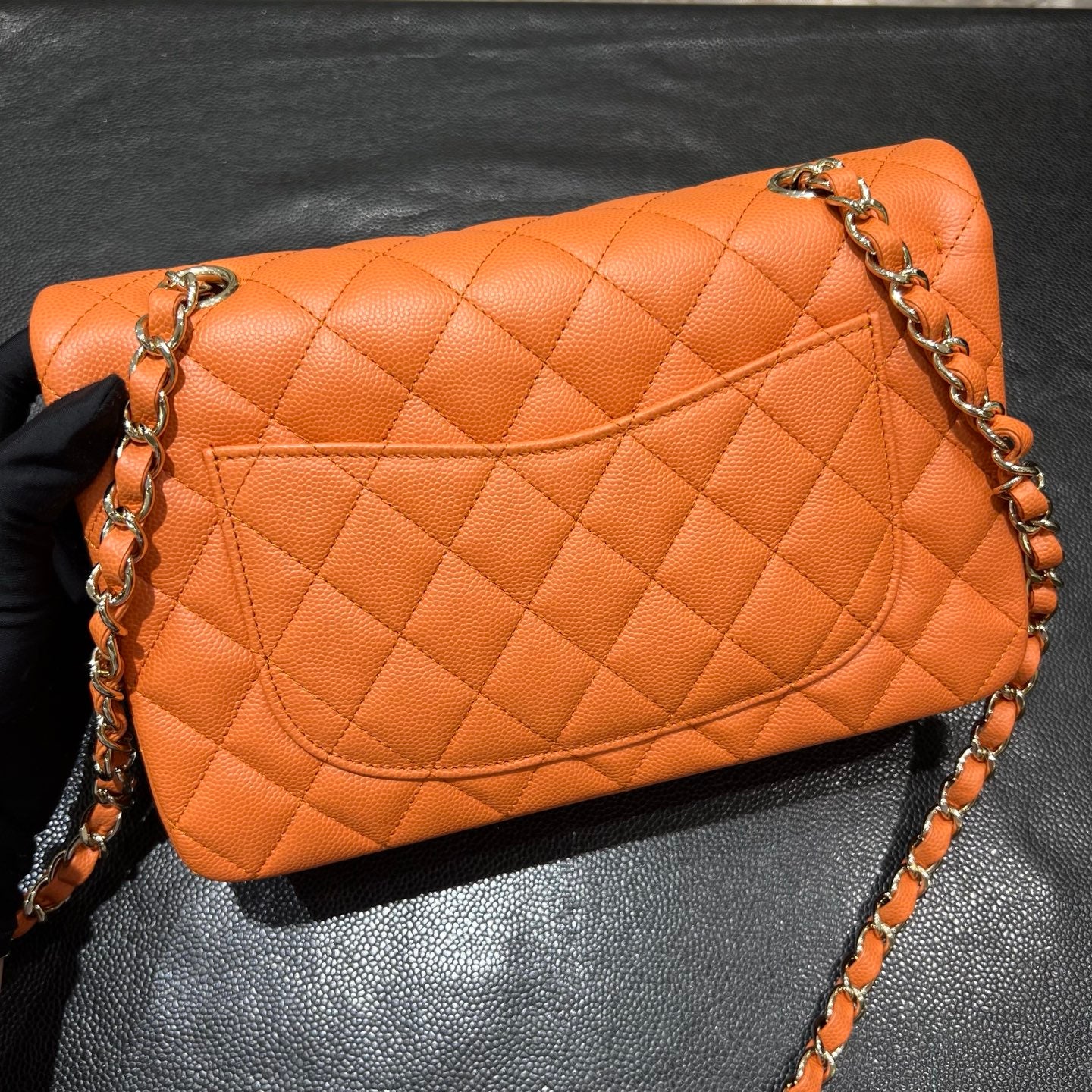 Chanel orange classic flap bag back view