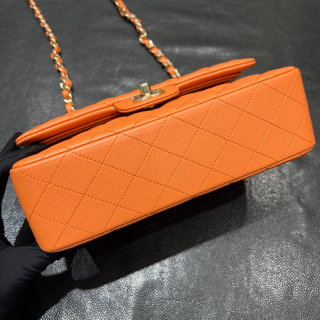 Chanel orange classic flap bag base view