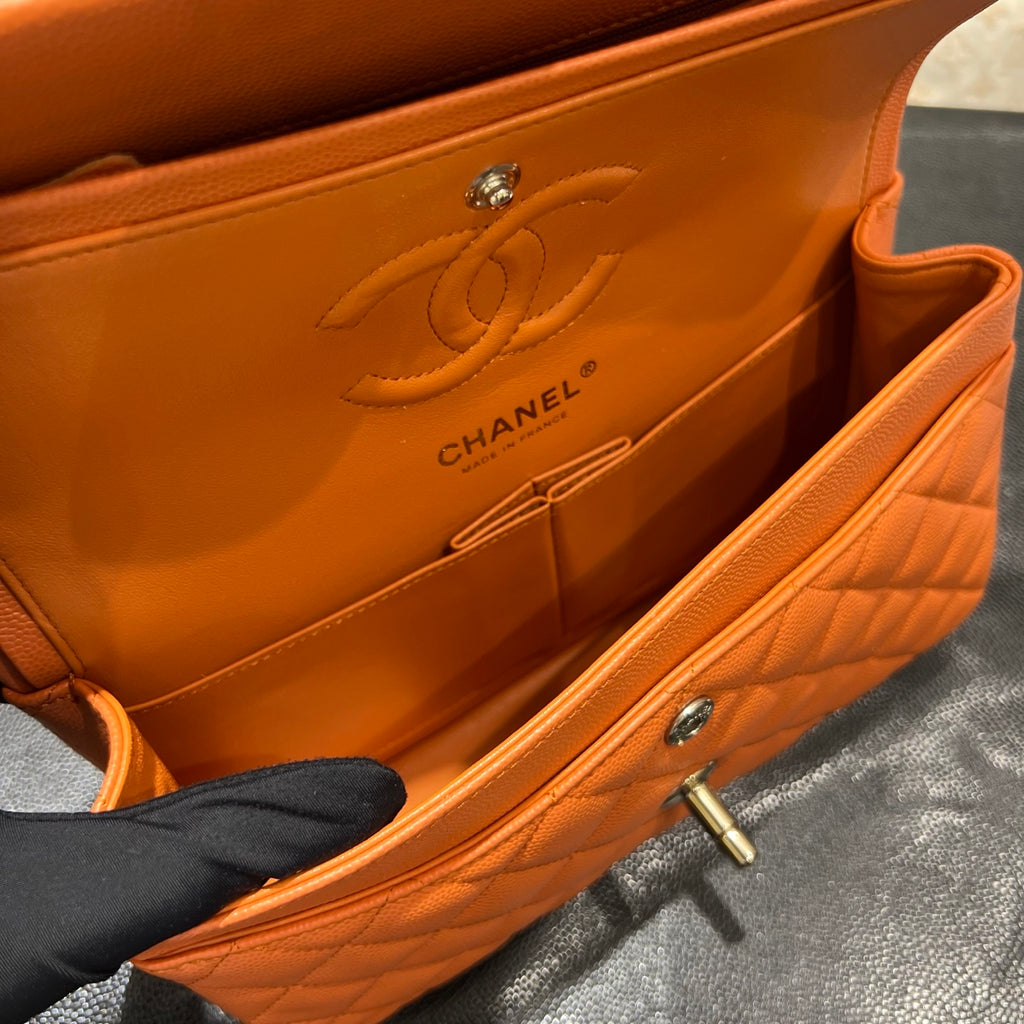 Chanel orange classic flap bag interior view