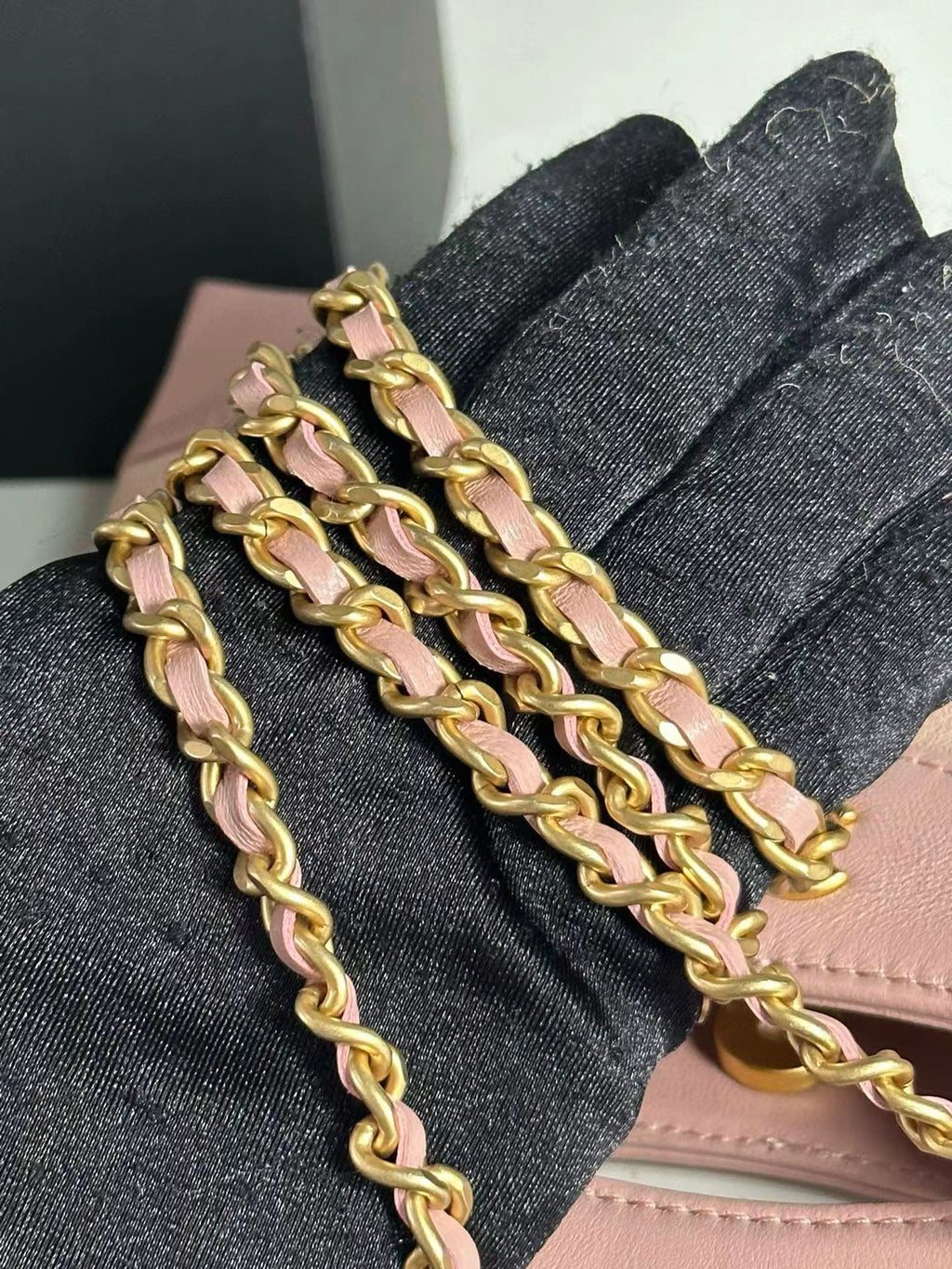 Pink Chanel handbag gold chain detail