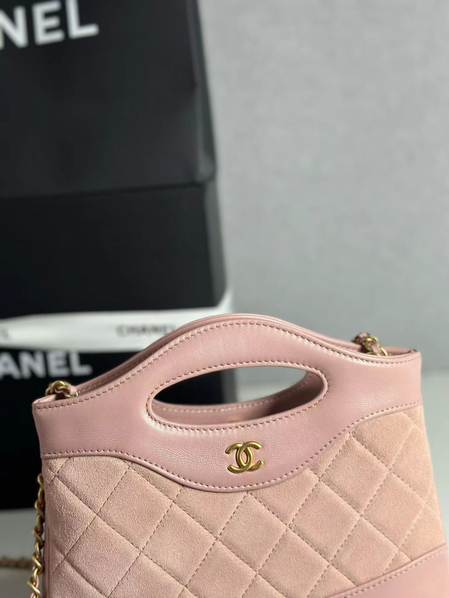 Pink Chanel handbag logo detail