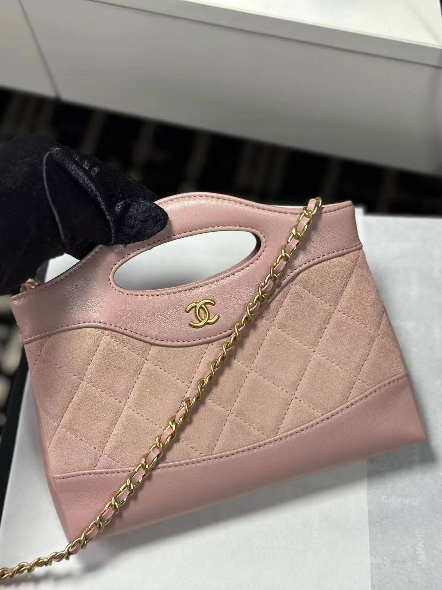 Pink Chanel quilted handbag front view