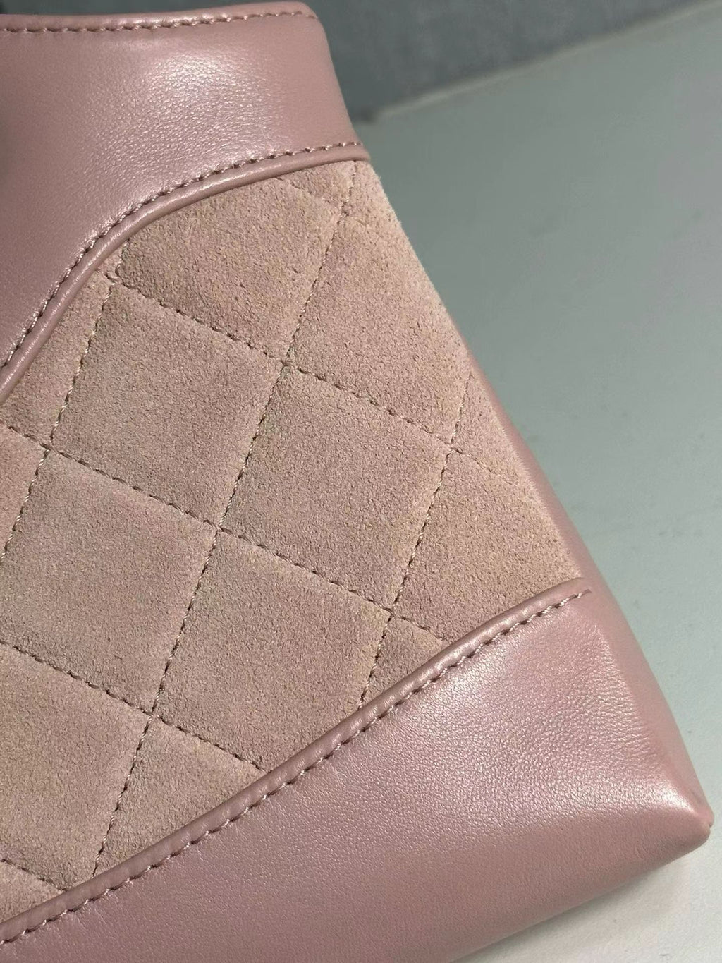 Pink Chanel handbag quilted material detail