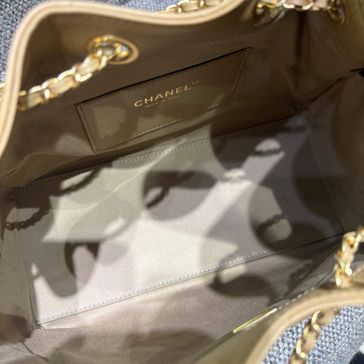 Chanel beige bucket bag interior label detail