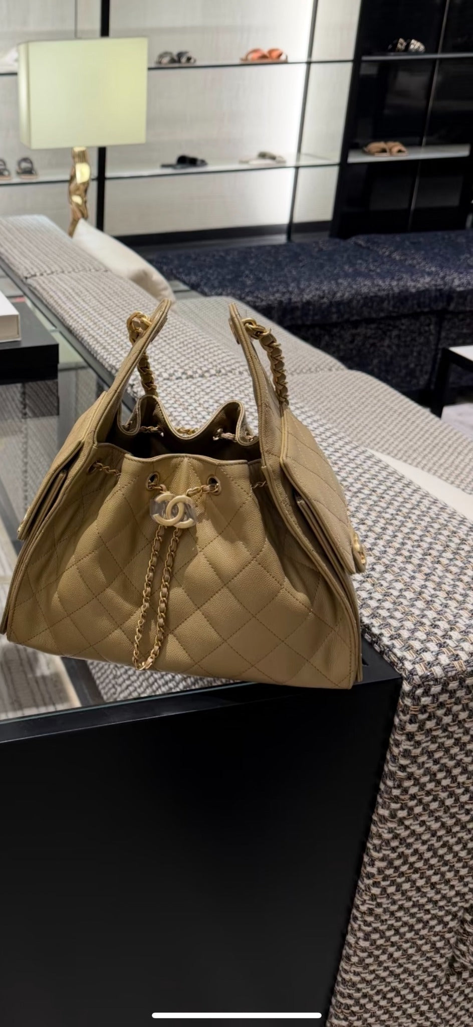 Chanel beige quilted drawstring bucket bag lifestyle view