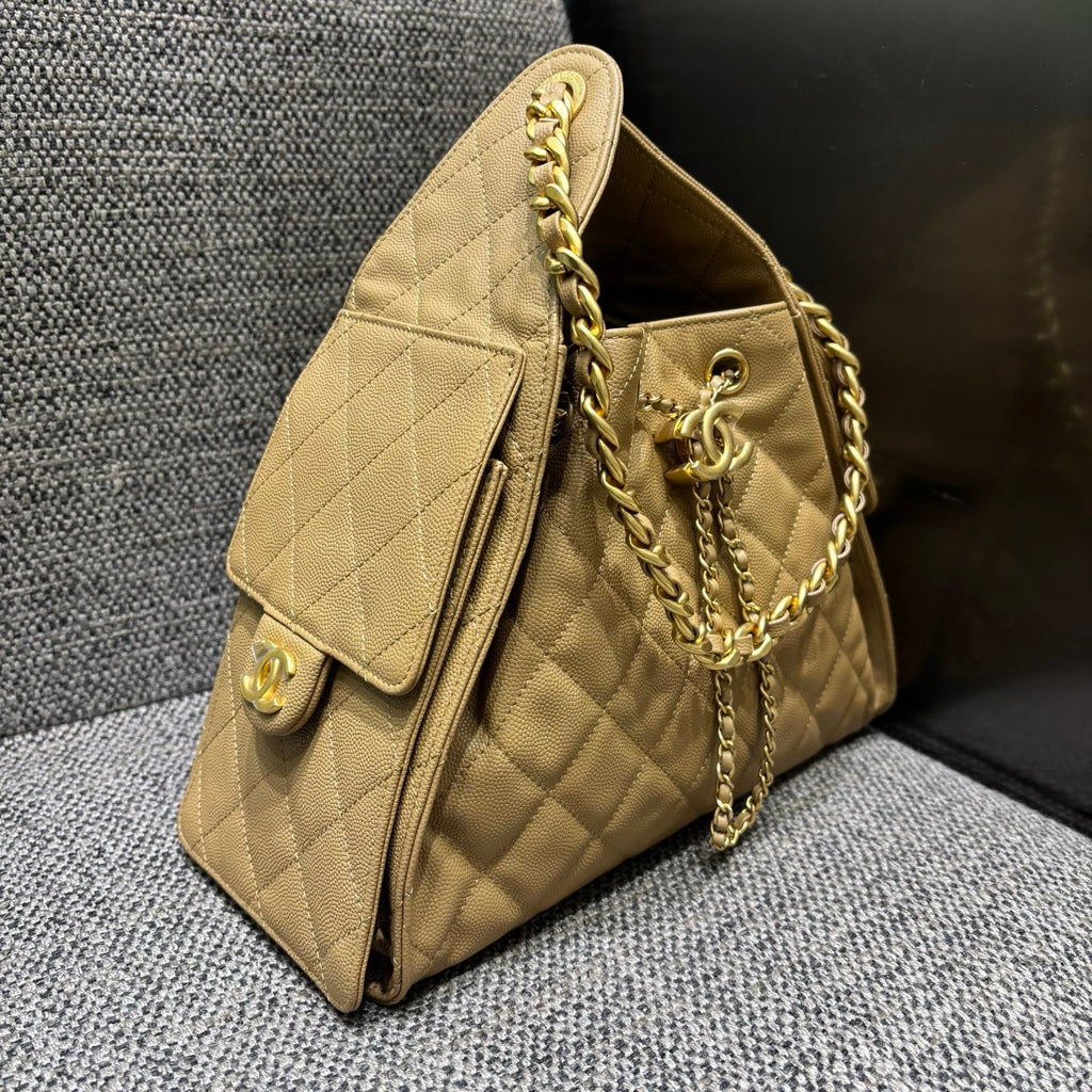 Chanel beige quilted bucket bag, side view