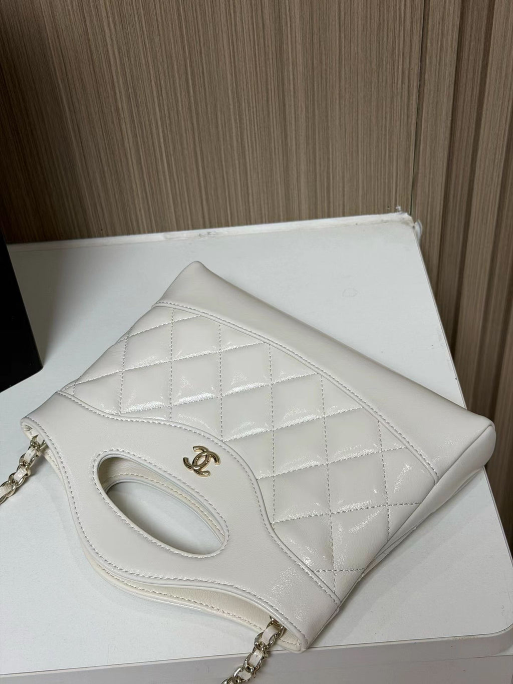 White quilted mini handbag back view