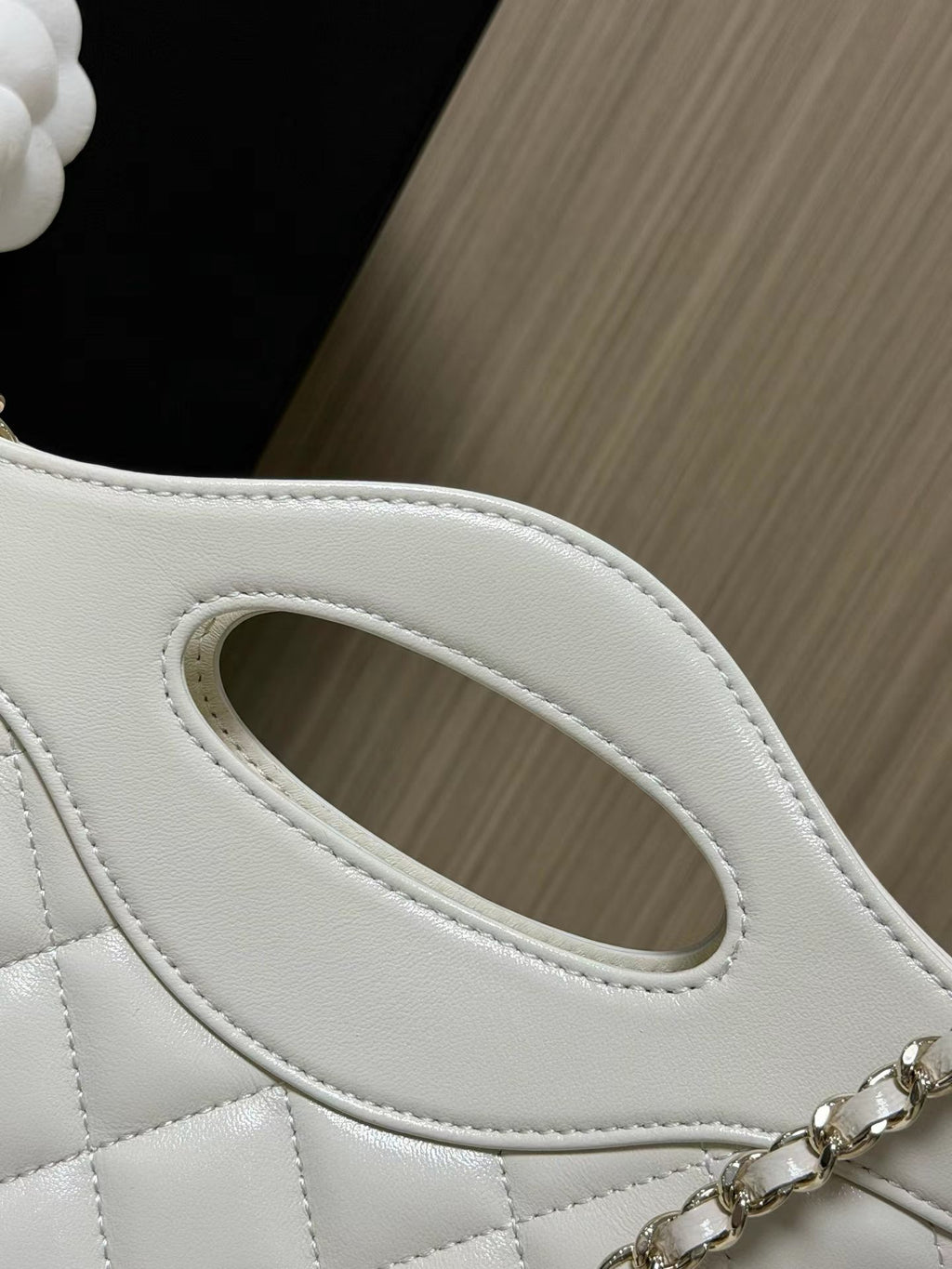 White mini handbag handle detail