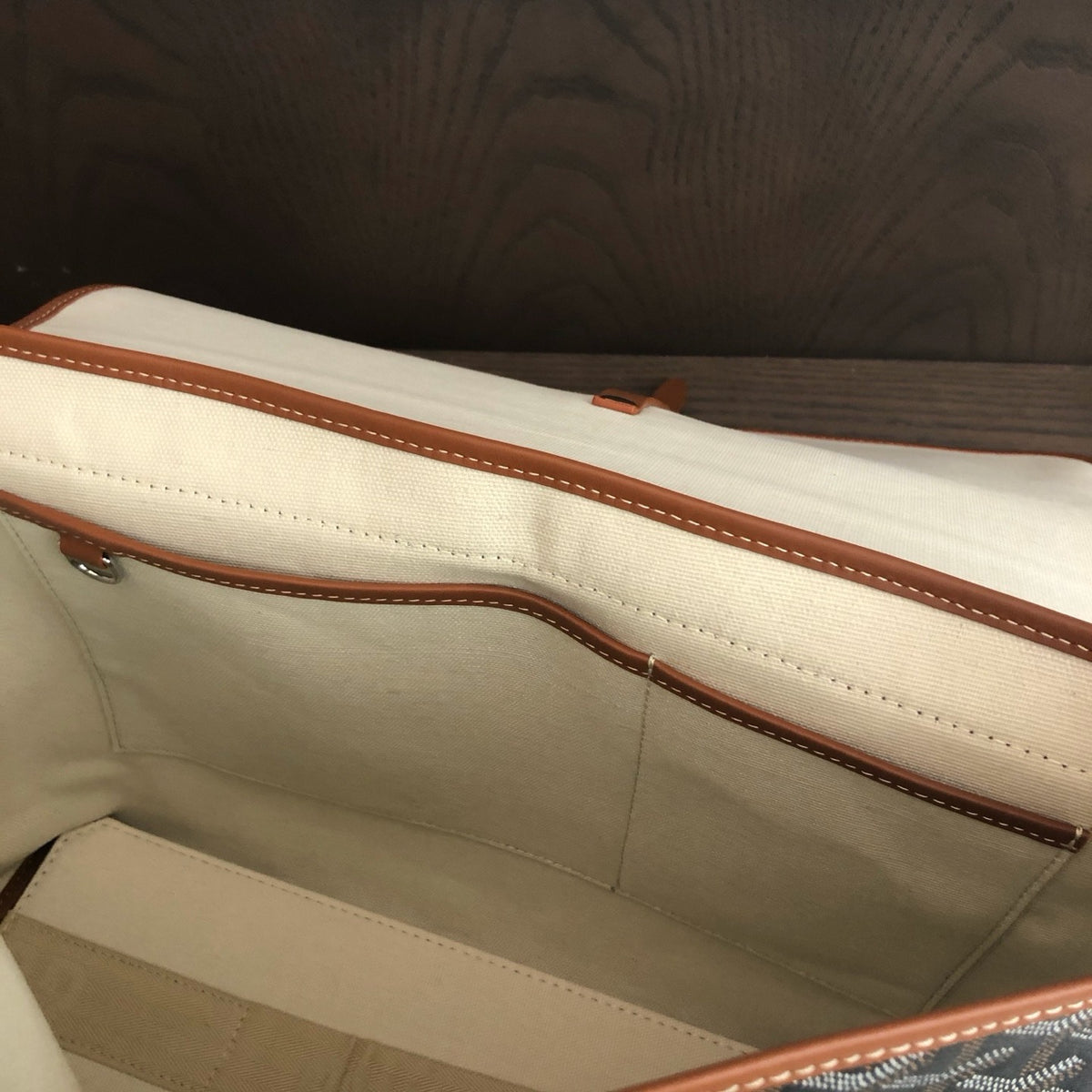 Messenger bag black and tan interior wide view