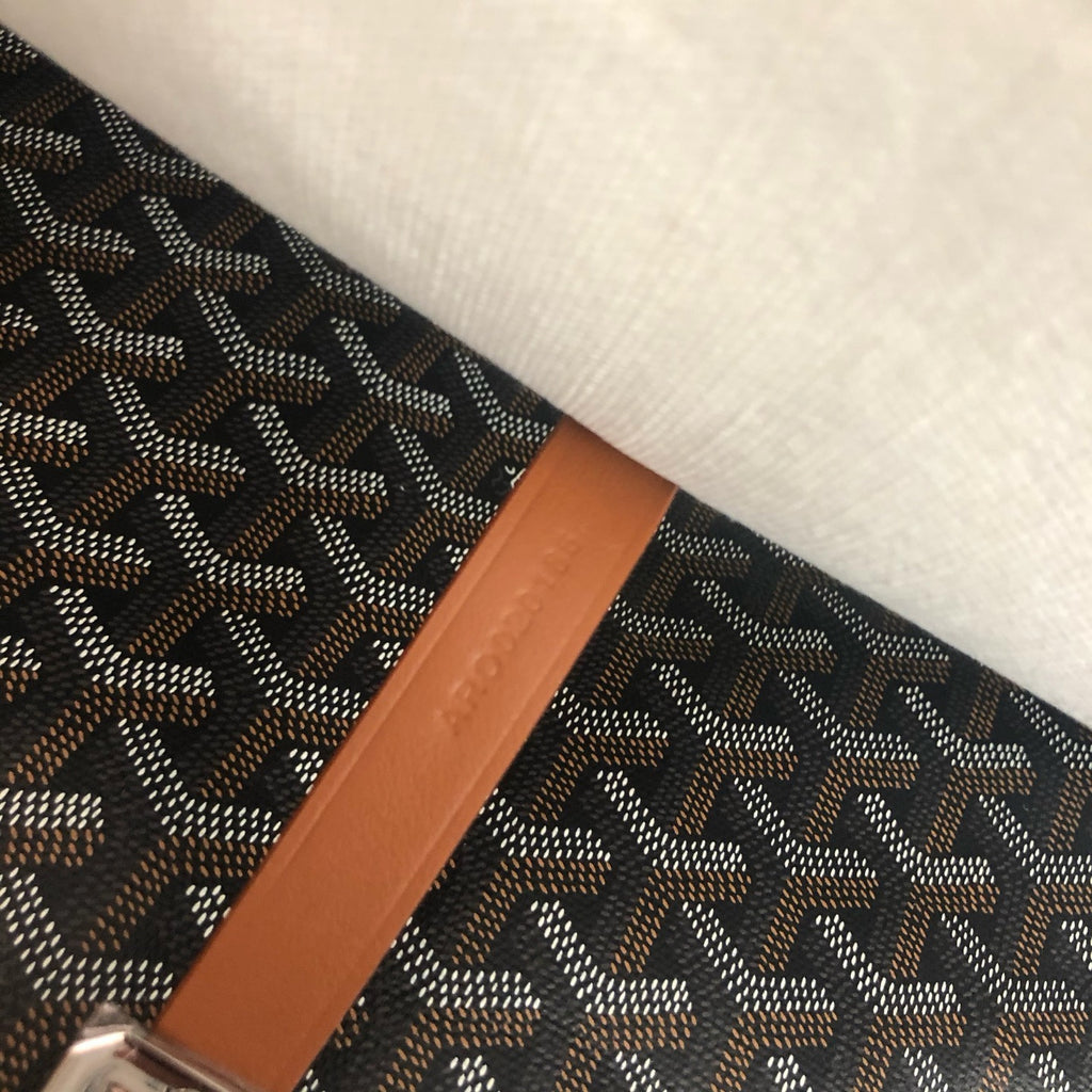 Messenger bag black and tan strap detail