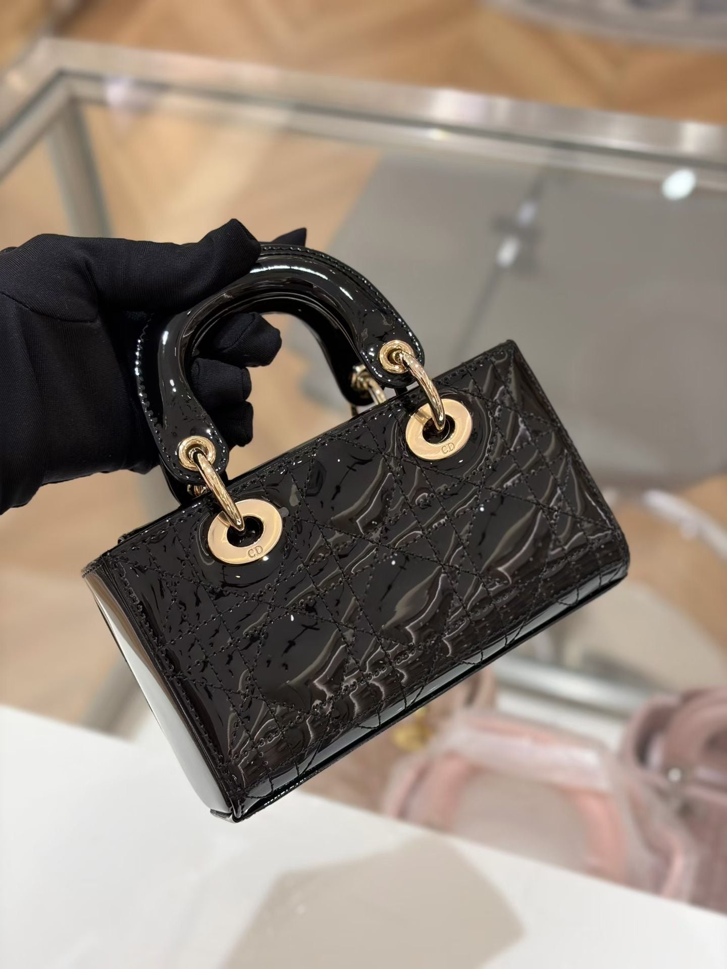 Lady Dior Mini black patent bag with gold hardware – back
