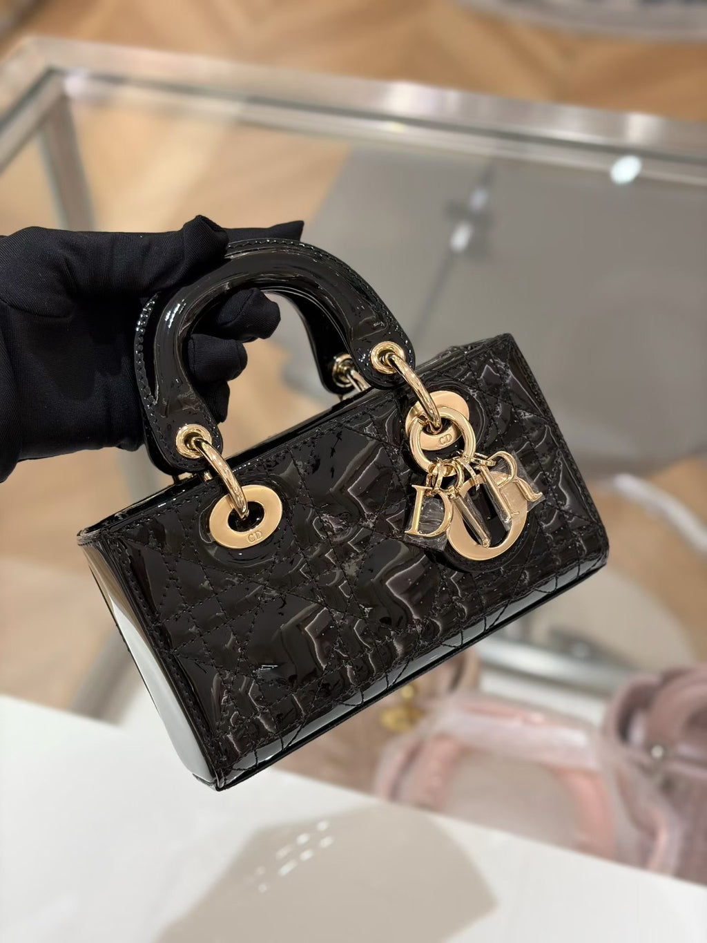 Lady Dior Mini black patent bag with gold hardware – front